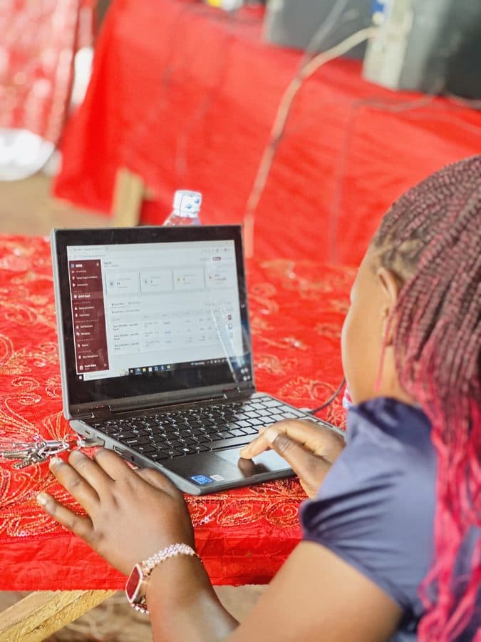 A school staff member using SIMS on a laptop to process payroll